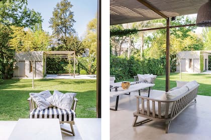 En el sector de living, sillones de respaldo circular y almohadones mullidos y mesa baja con tapa de mármol (Alejandra Hoeffner).