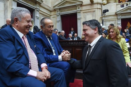 Francisco Paoltroni, con Duhalde y Rodríguez Saá