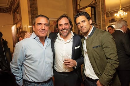Gigi Sarasola, Alexis Rosenfeld y Marcelo Berenstein.