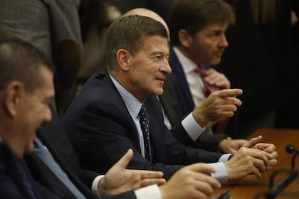 Guillermo Montenegro, Julián Ercolini (centro) y Andrés Basso