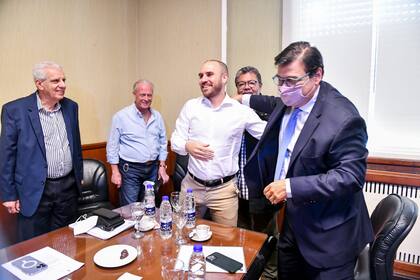 Guzmán y Moroni en su última visita a la CGT, rodeados por Lingeri, Rodríguez y Martínez