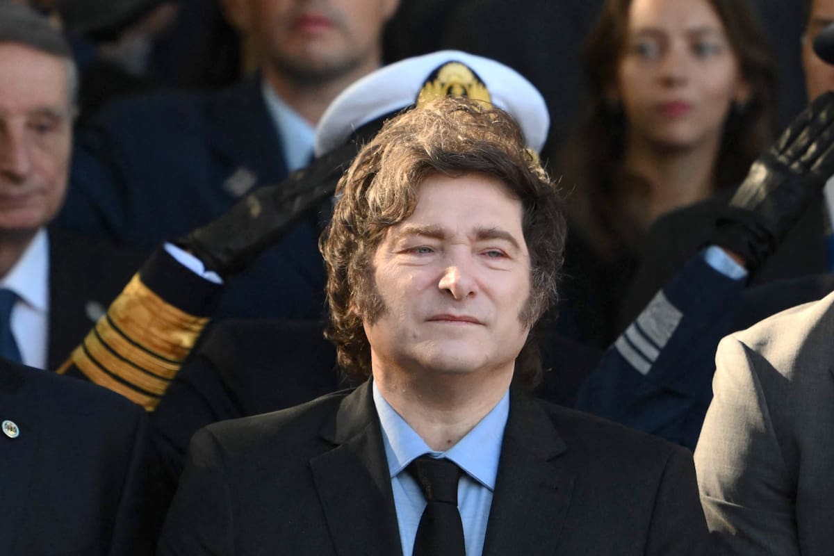 Head of Government of the city of Buenos Aires Jorge Macri (L), Argentina's President Javier Milei (C), and president of the Chamber of Deputies, Martin Menem (R), sing the national anthem during a ceremony to commemorate the 43rd anniversary of the war between Argentina and the United Kingdom over the Malvinas/Falkland Islands at the Cenotaph to the Fallen of the Malvinas War in Buenos Aires on April 2, 2025. (Photo by Luis ROBAYO / AFP)