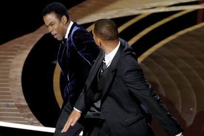 HOLLYWOOD, CALIFORNIA - MARCH 27: Will Smith appears to slap Chris Rock onstage during the 94th Annual Academy Awards at Dolby Theatre on March 27, 2022 in Hollywood, California. (Photo by Neilson Barnard/Getty Images)