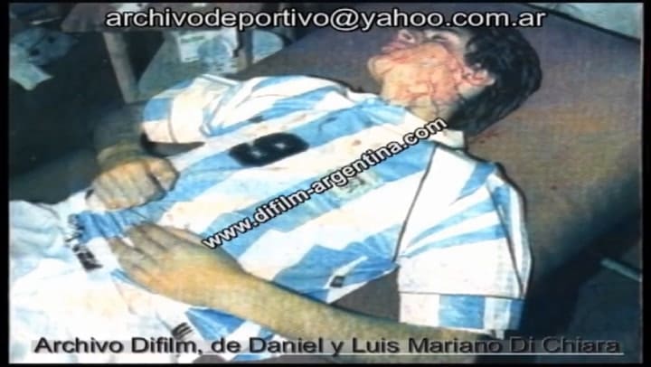 Piña a Julio Cruz y foto del corte en la cara