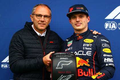 IMOLA, ITALY - APRIL 22: Pole position qualifier Max Verstappen of the Netherlands and Oracle Red Bull Racing collects his Pole Position award from Stefano Domenicali, CEO of the Formula One Group, in parc ferme during qualifying ahead of the F1 Grand Prix of Emilia Romagna at Autodromo Enzo e Dino Ferrari on April 22, 2022 in Imola, Italy. (Photo by Dan Istitene - Formula 1/Formula 1 via Getty Images)