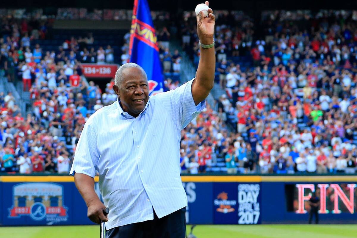 In this file photo taken on October 02, 2016, Hall of Famer Hank Aaron throws out the ceremonial last pitch at Turner Field to Bobby Cox after the game between the Atlanta Braves and the Detroit Tigers at Turner Field in Atlanta, Georgia. -