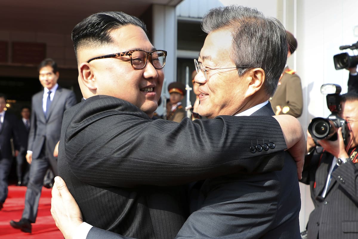 In this photo provided by South Korea Presidential Blue House via Yonhap News Agency, North Korean leader Kim Jong Un, left, and South Korean President Moon Jae-in embrace each other after their meeting at the northern side of the Panmunjom in North Korea, Saturday, May 26, 2018. Kim and Moon have m