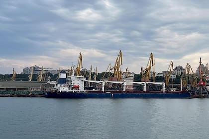 In this photo provided by the Ukrainian Infrastructure Ministry Press Office, the Razoni cargo ship, under the flag of Sierra Leone, with 26,000 tons of the Ukrainian corn aboard, leaves the port in Odesa region, Ukraine, Monday, Aug. 1, 2022. The first ship carrying Ukrainian grain set off from the port of Odesa on Monday under an internationally brokered deal and is expected to reach Istanbul on Tuesday, where it will be inspected, before being allowed to proceed. (Ukrainian Infrastucture Ministry Press Office via AP)