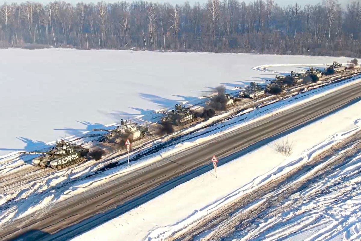 In this photo taken from video provided by the Russian Defense Ministry Press Service on Tuesday, Feb. 15, 2022, Russian army tanks move back to their permanent base after drills in Russia. In what could be another sign that the Kremlin would like to lower the temperature, Russia's Defense Ministry announced Tuesday that some units participating in military exercises would begin returning to their bases. (Russian Defense Ministry Press Service via AP)
