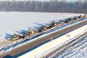 In this photo taken from video provided by the Russian Defense Ministry Press Service on Tuesday, Feb. 15, 2022, Russian army tanks move back to their permanent base after drills in Russia. In what could be another sign that the Kremlin would like to lower the temperature, Russia's Defense Ministry announced Tuesday that some units participating in military exercises would begin returning to their bases. (Russian Defense Ministry Press Service via AP)