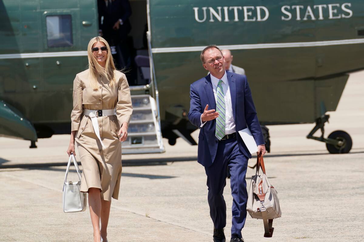 Ivanka Trump, daughter of President Donald Trump walks off of Marine One with acting chief of staff Mick Mulvaney to board Air Force One at Andrews Air Force Base, Md., Wednesday, June 26, 2019. Trump is