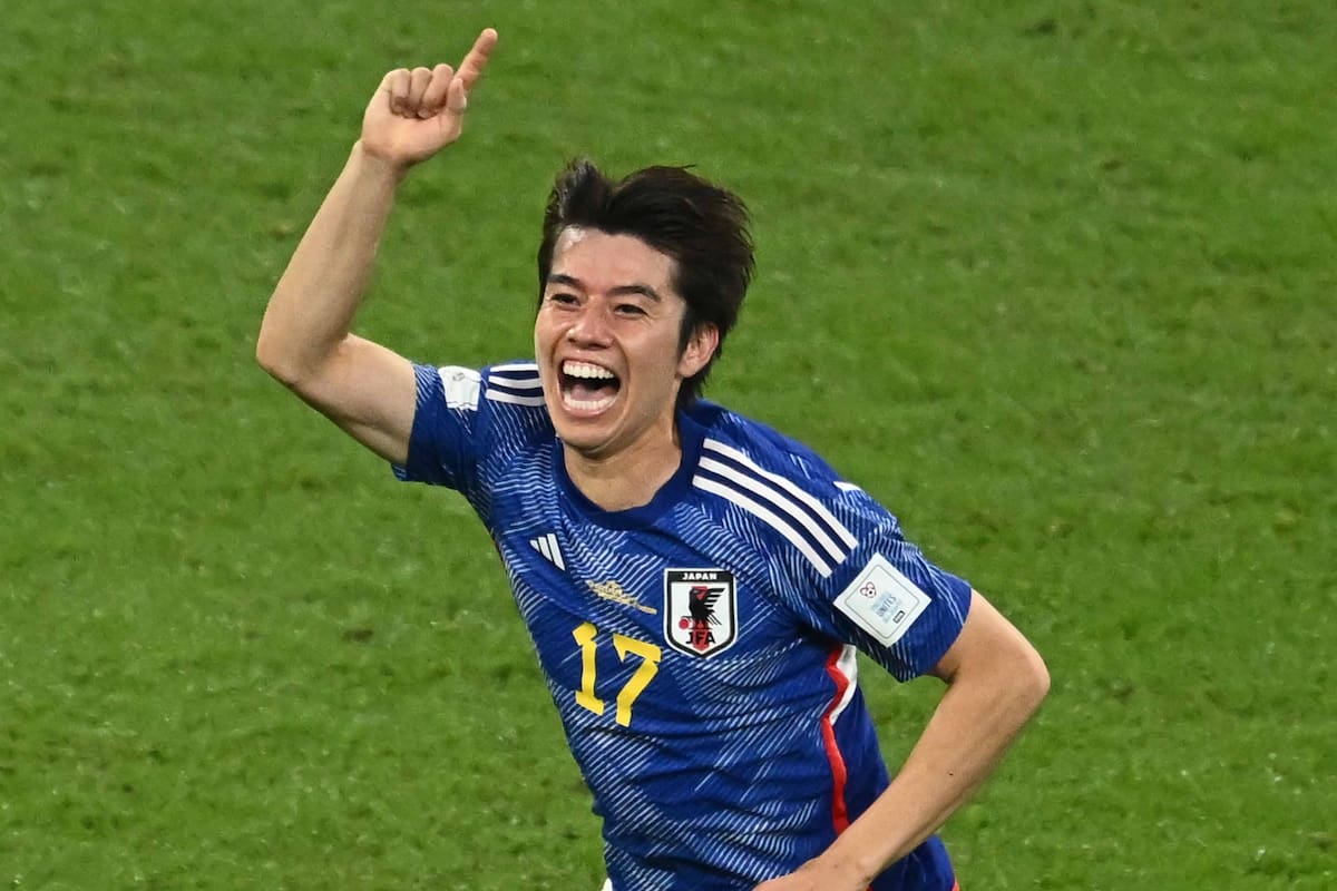 Japan's midfielder #17 Ao Tanaka celebrates scoring his team's second goal with his teammates during the Qatar 2022 World Cup Group E football match between Japan and Spain at the Khalifa International Stadium in Doha on December 1, 2022. (Photo by Jewel SAMAD / AFP)