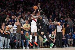 Jerami Grant emboca el triple decisivo y Portland vence 108-104 a Minnesota