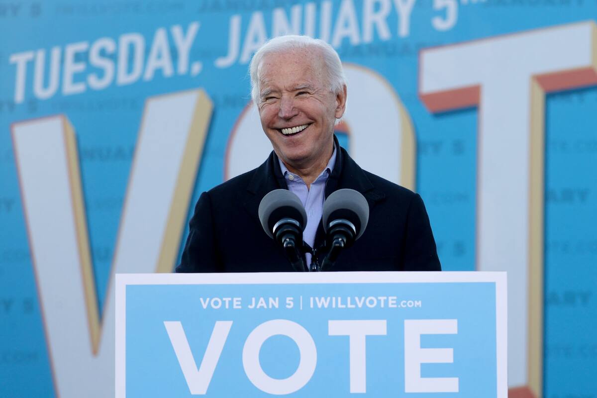 Joe Biden, ayer, en un acto de campaña de Jon Ossoff y Raphael Warnock
