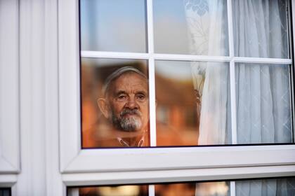 John Pollard, esperando su cita para una vacuna contra el coronavirus. "Te cansas de tu propia empresa", dijo sobre los cierres de Gran Bretaña.