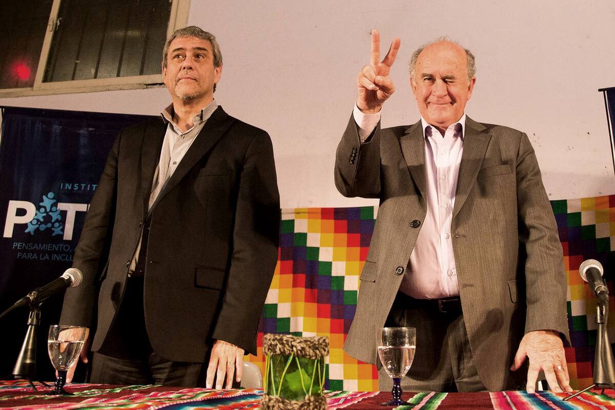 Jorge Ferraresi junto a Oscar Parrili en un encuentro del Instituto Patria en el partido de Merlo