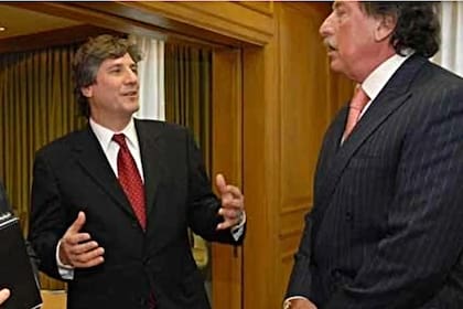 Jorge Brito y Amado Boudou, que ayer expresó su dolor por la muerte del banquero
