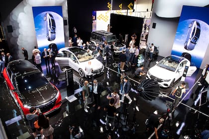 Journalists take a look at the new models at the Mercedes stand before the start of the International Motor Show (IAA Mobility) in Munich, Germany, Monday, Sept.6, 2021. (Sven Hoppe/dpa via AP)
