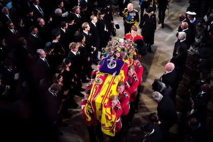 King Charles III and the Queen Consort follow the coffin during the Committal Service for Queen Elizabeth II at St George's Chapel, at Windsor Castle, Windsor, England, Monday Sept. 19, 2022. The Queen, who died aged 96 on Sept. 8, will be buried at Windsor alongside her late husband, Prince Philip, who died last year. (Ben Birchall/Pool via AP)