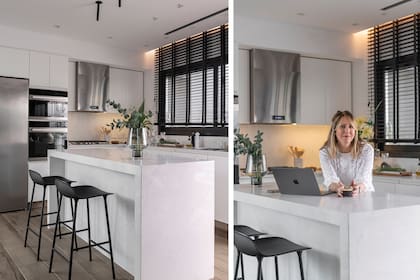 La arquitecta Melina Trogolo, al frente de MTD Arquitectura, en la cocina que ideó: tanto el mueble como la isla son de madera laqueada, con banquetas (Adelphi).