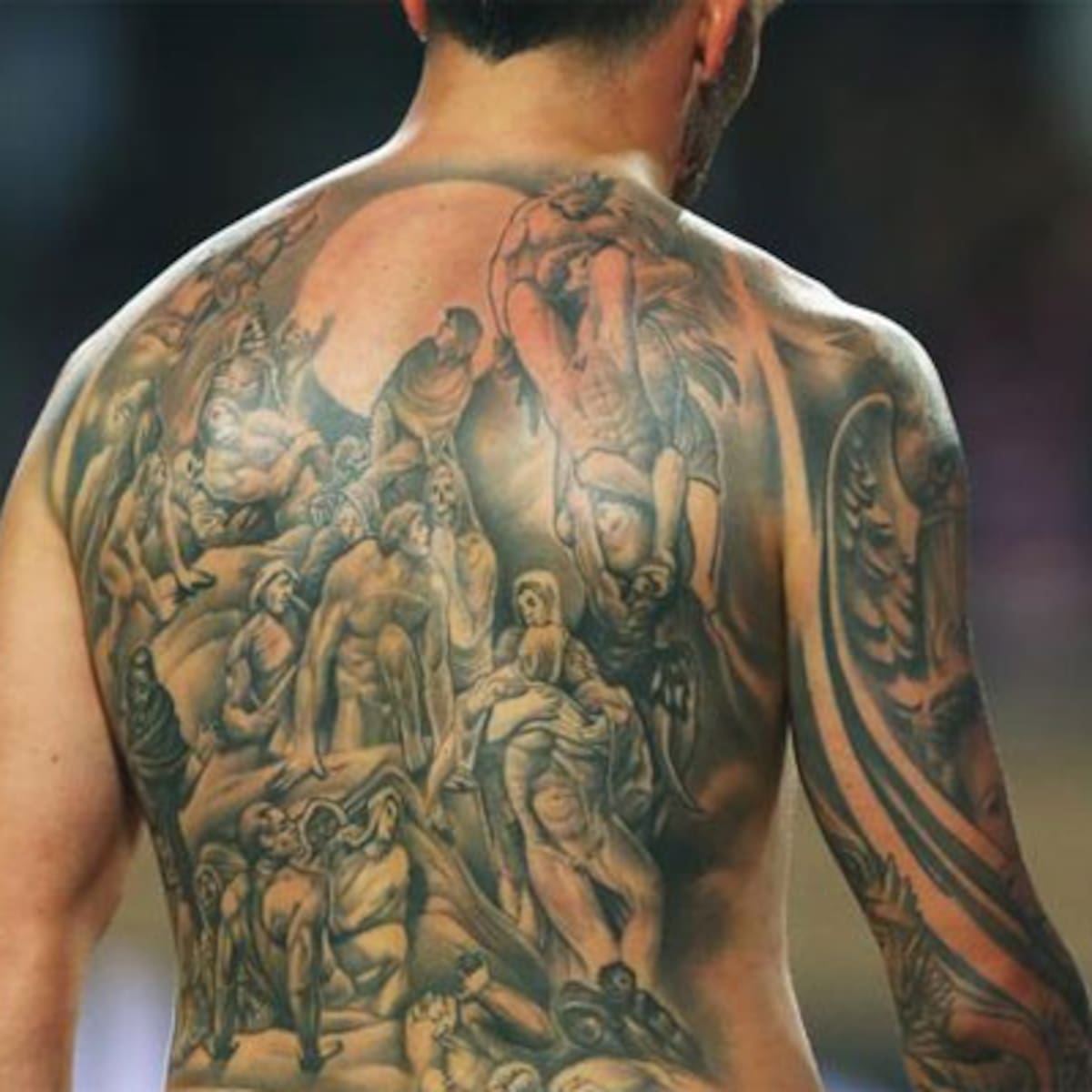Carlos Tevez side view of giant back tattoo
