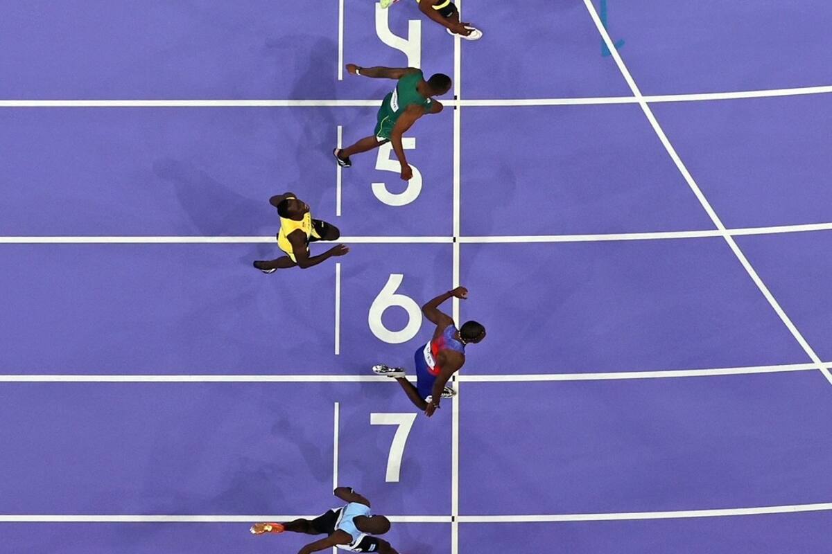 La llegada de la final de los 100 metros, una imagen icónica de la definición de unas de las "pruebas madre" de los Juegos