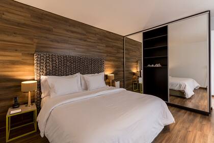 Las habitaciones del hotel que tuvo varios usos diferentes hasta convertirse en lo que es hoy