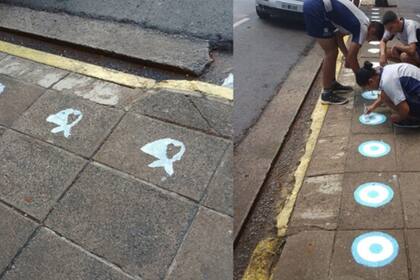 Las pintadas de los pañuelos realizadas durante la marcha por el Día de la Memoria y la intervención que realizaron tres soldados, en la vereda de la Brigada en la calle San Martín casi Colón, del microcentro posadeño