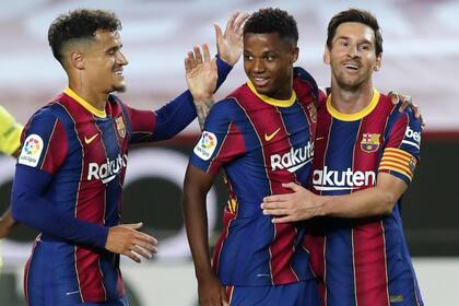 Lionel Messi con Ansu Fati y Coutinho, en sus tiempos en Barcelona