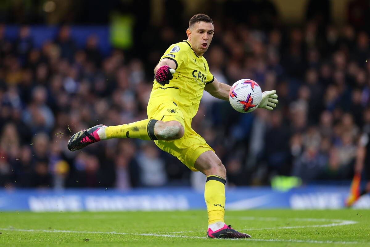 LONDON, ENGLAND - APRIL 01: Emiliano Martinez of Aston Villa kicks the ball upfield during the Premier League match between Chelsea FC and Aston Villa at Stamford Bridge on April 01, 2023 in London, England. (Photo by Marc Atkins/Getty Images)