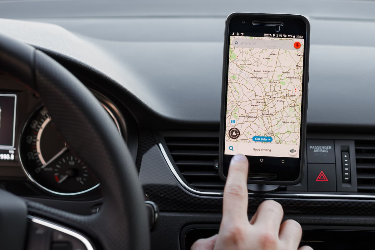 LOS ANGELES, CALIFORNIA - JUNE 6, 2019: Close up to male driving and using navigation appliction Google Maps. Get direction. An illustrative editorial image