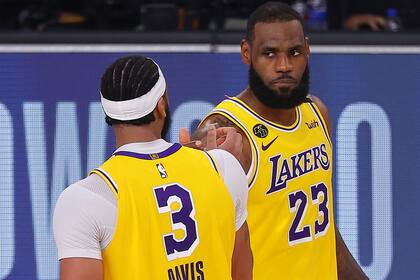 Los Angeles Lakers LeBron James (23) drives against Denver Nuggets Jerami Grant (9) during the first half of an NBA conference final playoff basketball game Thursday, Sept. 24, 2020