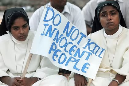 Los cristianos son una minoría religiosa en la India. El cartel reza: "no maten a gente inocente"