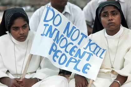 Los cristianos son una minoría religiosa en la India. El cartel reza: "no maten a gente inocente"