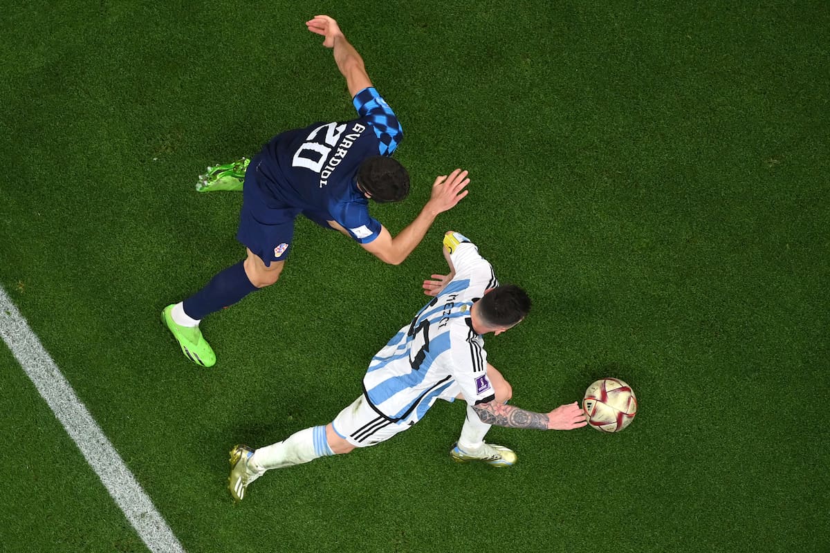 LUSAIL CITY, QATAR - DECEMBER 13: Lionel Messi of Argentina controls the ball against Josko Gvardiol of Croatia during the FIFA World Cup Qatar 2022 semi final match between Argentina and Croatia at Lusail Stadium on December 13, 2022 in Lusail City, Qatar. (Photo by Dan Mullan/Getty Images)