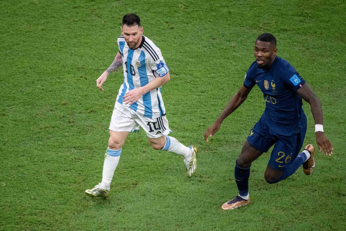 LUSAIL CITY, QATAR - DECEMBER 18: Lionel Messi of Argentina and Marcus Thuram of France in action during the FIFA World Cup Qatar 2022 Final match between Argentina and France at Lusail Stadium on December 18, 2022 in Lusail City, Qatar. (Photo by Sebastian Frej/MB Media/Getty Images)