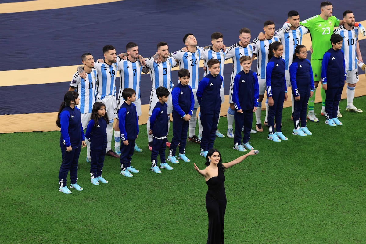 LUSAIL CITY, QATAR - DECEMBER 18: Singer Lali Esposito sings the national anthem in front of Argentina players line up for the national anthem prior to the FIFA World Cup Qatar 2022 Final match between Argentina and France at Lusail Stadium on December 18, 2022 in Lusail City, Qatar. (Photo by Buda Mendes/Getty Images)