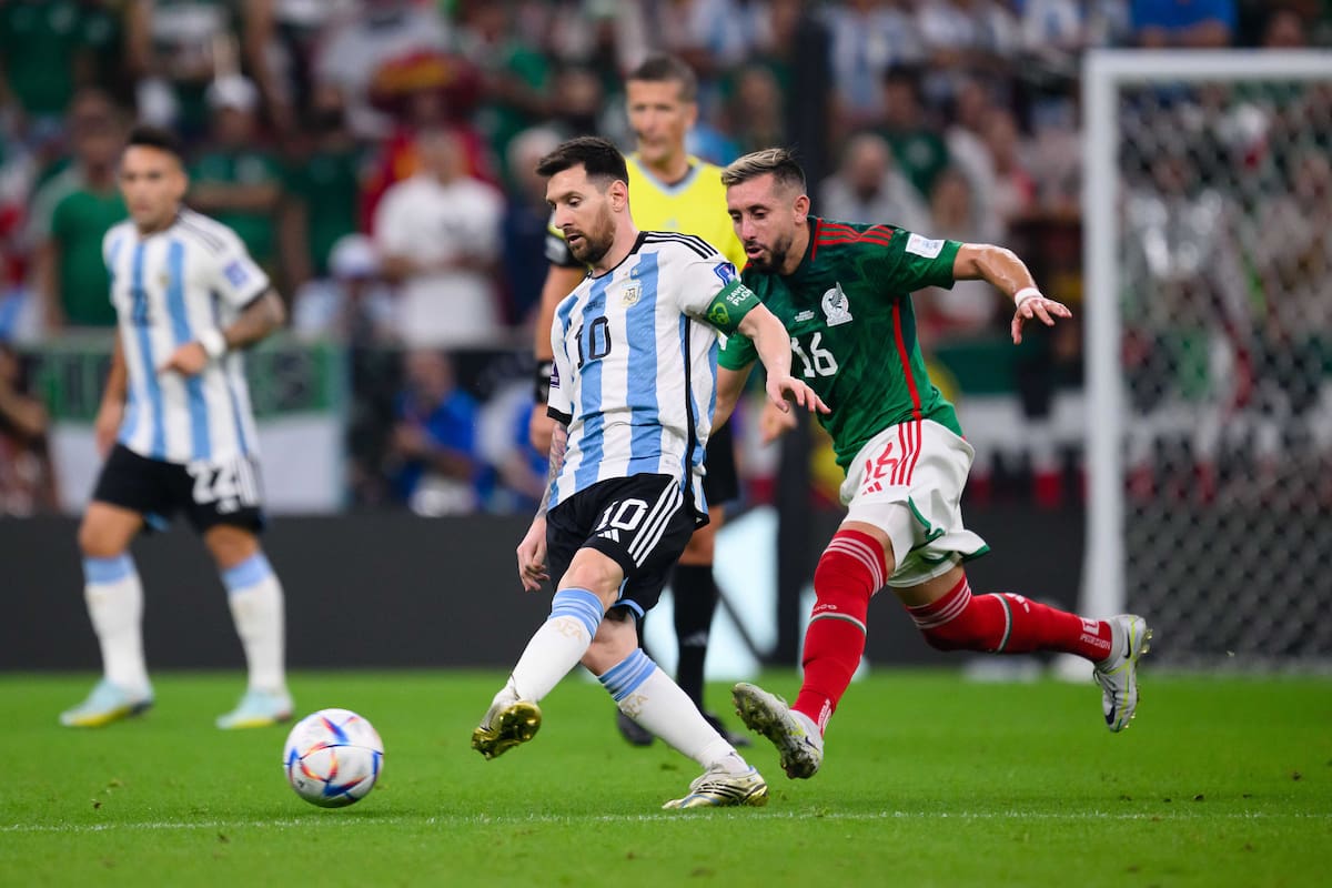LUSAIL CITY, QATAR - NOVEMBER 26: Lionel Messi of Argentinia (L) battles for possession with Hector Herrera of Mexico (R) during the FIFA World Cup Qatar 2022 Group C match between Argentina and Mexico at Lusail Stadium on November 26, 2022 in Lusail City, Qatar. (Photo by Markus Gilliar - GES Sportfoto/Getty Images)