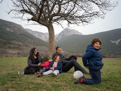 María Otero, a web designer who found she could telecommute, with her husband and three children in the village of Gósol, Spain on March 3, 2021. Gósol had spent years begging outsiders to come repopulate it; since 2020, many have come to try the quiet life. (Samuel Aranda/The New York Times)