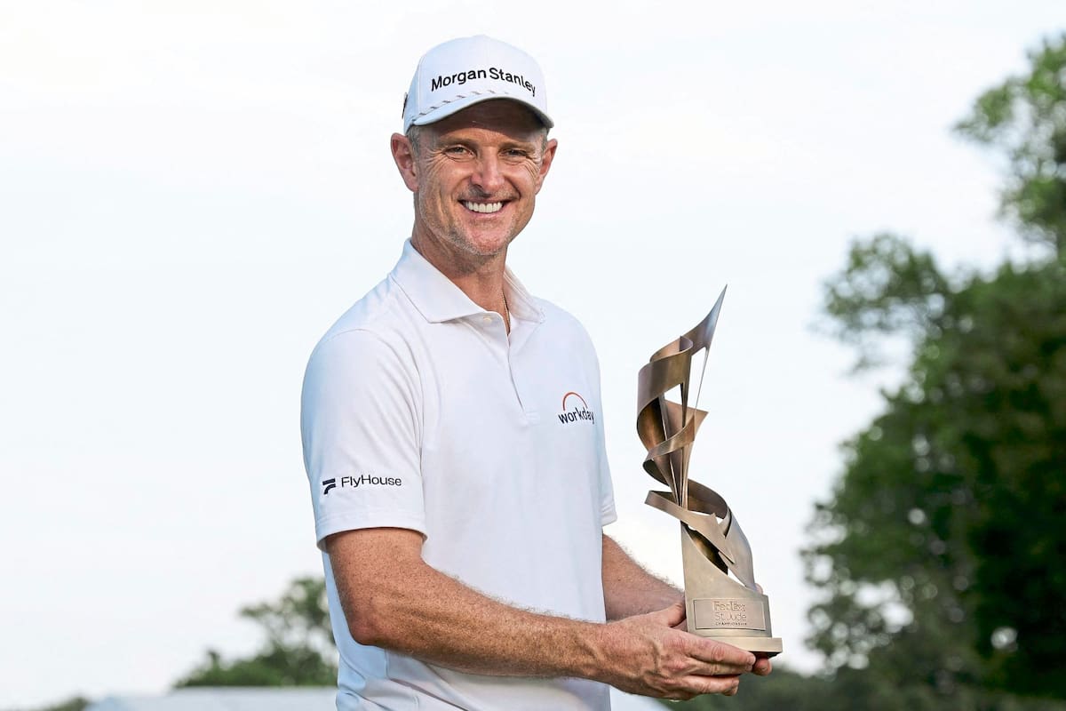 MEMPHIS, TENNESSEE - AUGUST 10: Justin Rose of England poses with the trophy after winning the FedEx St. Jude Championship 2025 at TPC Southwind on August 10, 2025 in Memphis, Tennessee. Andy Lyons/Getty Images/AFP (Photo by ANDY LYONS / GETTY IMAGES NORTH AMERICA / Getty Images via AFP)