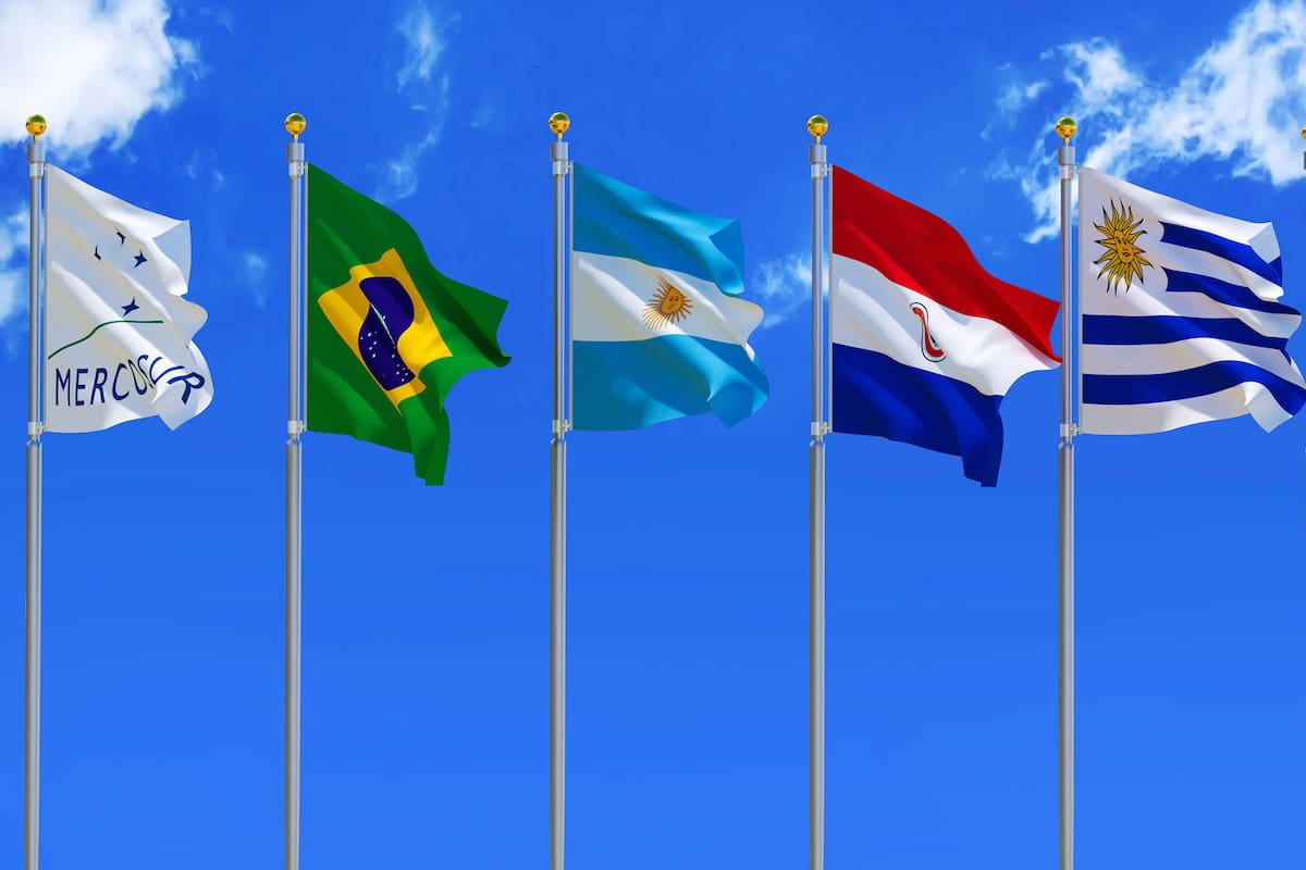 MERCOSUR flag Silk waving flags MERCOSUR Brazil Argentina Paraguay Uruguay Venezuela five members with a flagpole on a sunny blue sky background with white clouds 3D illustration
