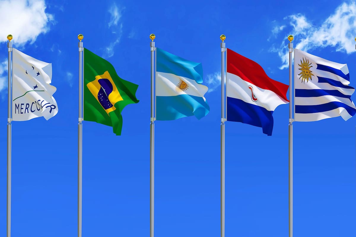 MERCOSUR flag Silk waving flags MERCOSUR Brazil Argentina Paraguay Uruguay Venezuela five members with a flagpole on a sunny blue sky background with white clouds 3D illustration