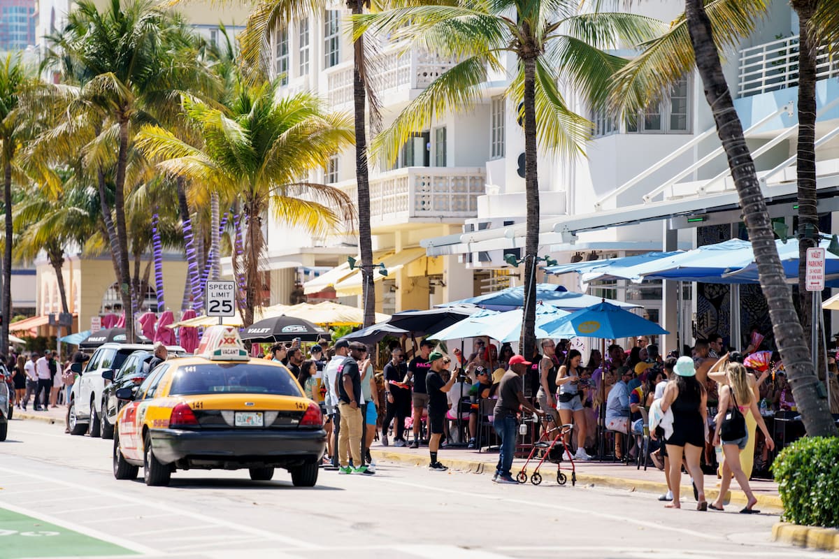 Miami Beach, FL, USA - March 12, 2022: Scene on Ocean Drive showing crowds of tourists visiting for Spring Break vacation holiday