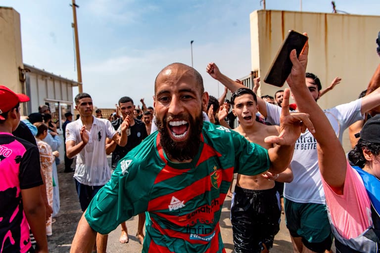 Migrants cross from Morocco into the Spanish enclave of Ceuta, Thursday, July 30, 2026. (AP Photo/Antonio Sempere)