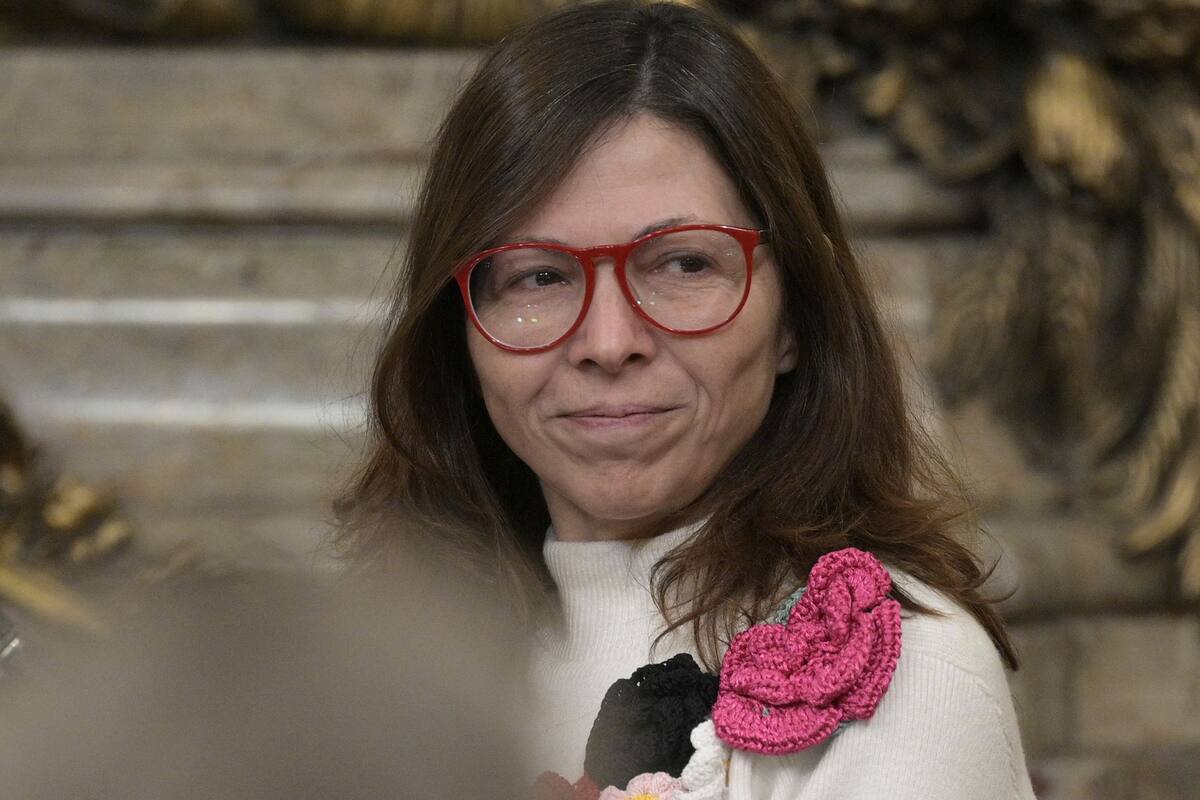 Ministra de economía Silvina Batakis gestures next to Presiden Alberto Fernandez (out of frame) during her swear in ceremony at the Casa Rosada in Buenos Aires on July 4, 2022. - Argentina appointed economist Silvina Batakis as its new Economy Minister Sunday after Martin Guzman, the architect of a debt restructuring deal with the IMF, unexpectedly resigned. (Photo by JUAN MABROMATA / AFP)