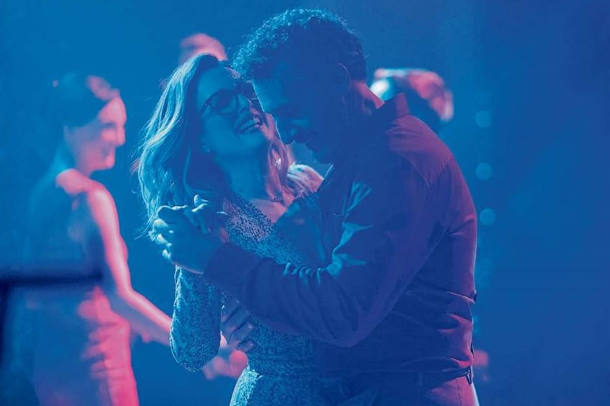 Moore y John Turturro, en una escena del film