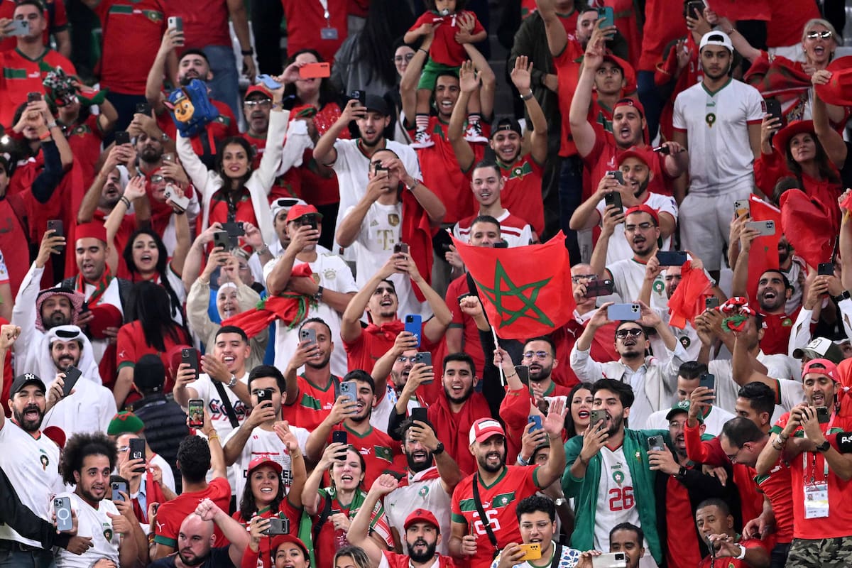 Morocco supporters celebrate after their team won the Qatar 2022 World Cup round of 16 football match between Morocco and Spain at the Education City Stadium in Al-Rayyan, west of Doha on December 6, 2022. (Photo by Kirill KUDRYAVTSEV / AFP)
