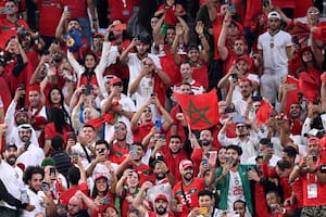 Morocco supporters celebrate after their team won the Qatar 2022 World Cup round of 16 football match between Morocco and Spain at the Education City Stadium in Al-Rayyan, west of Doha on December 6, 2022. (Photo by Kirill KUDRYAVTSEV / AFP)