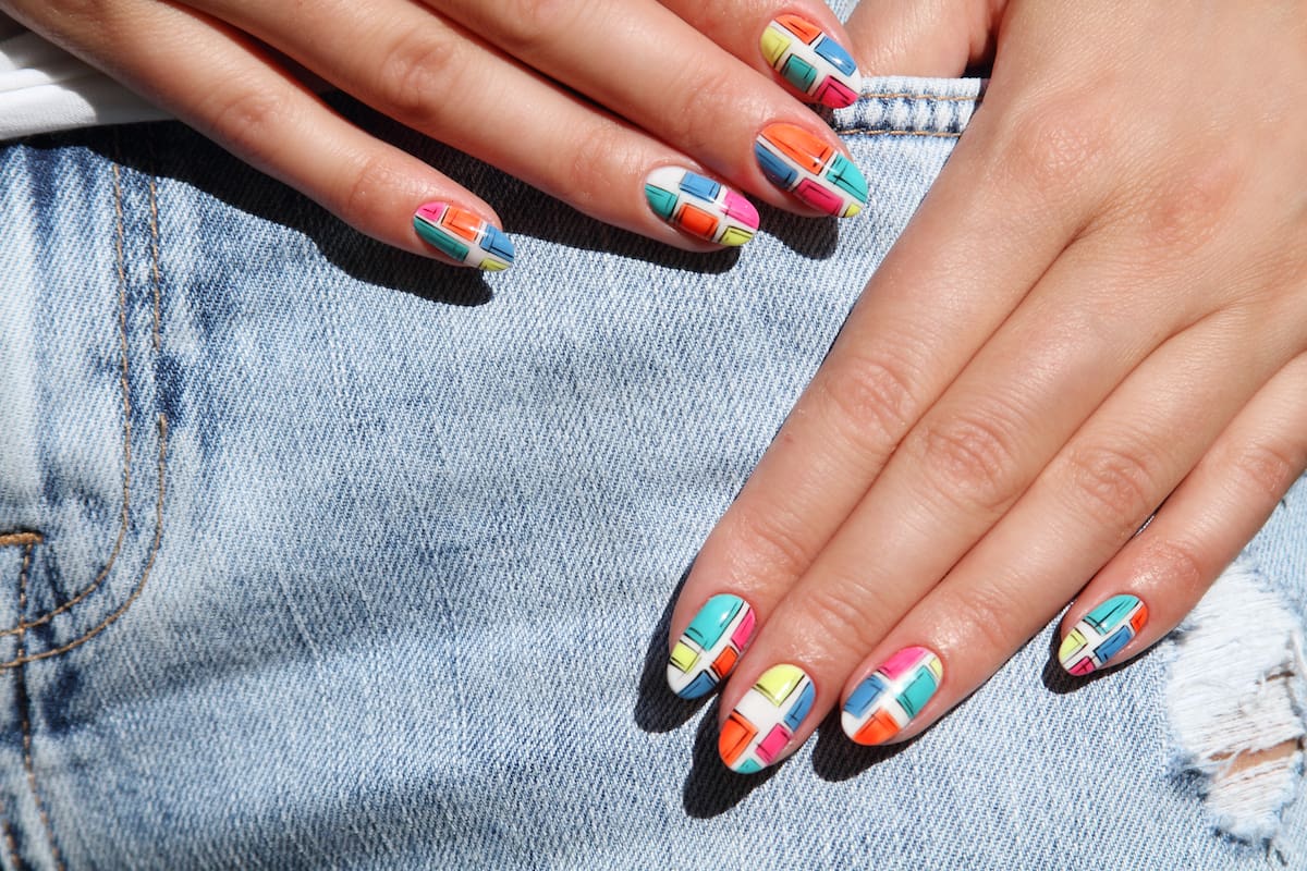 Nail design . Manicure nail paint . beautiful female hand with colorful nail art design manicure