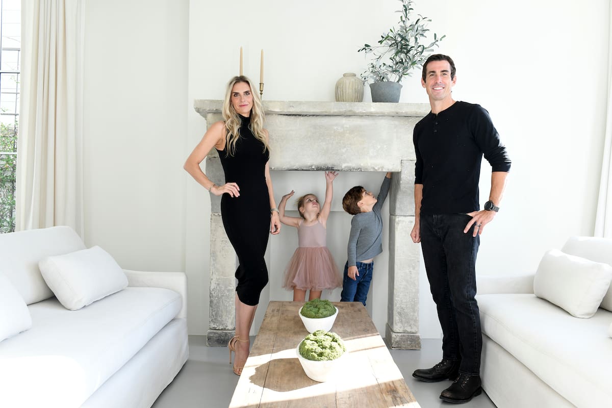 Nicole and Taylor Feininger with their children Grey, 5, and Elle, 3, at home in Manhattan Beach, Calif., on Oct. 30, 2022. Nicole Feininger, a Southern California designer, wanted to create a home where “everything gets put away at night” — and she succeeded. Sort of. (Axel Koester/The New York Times)